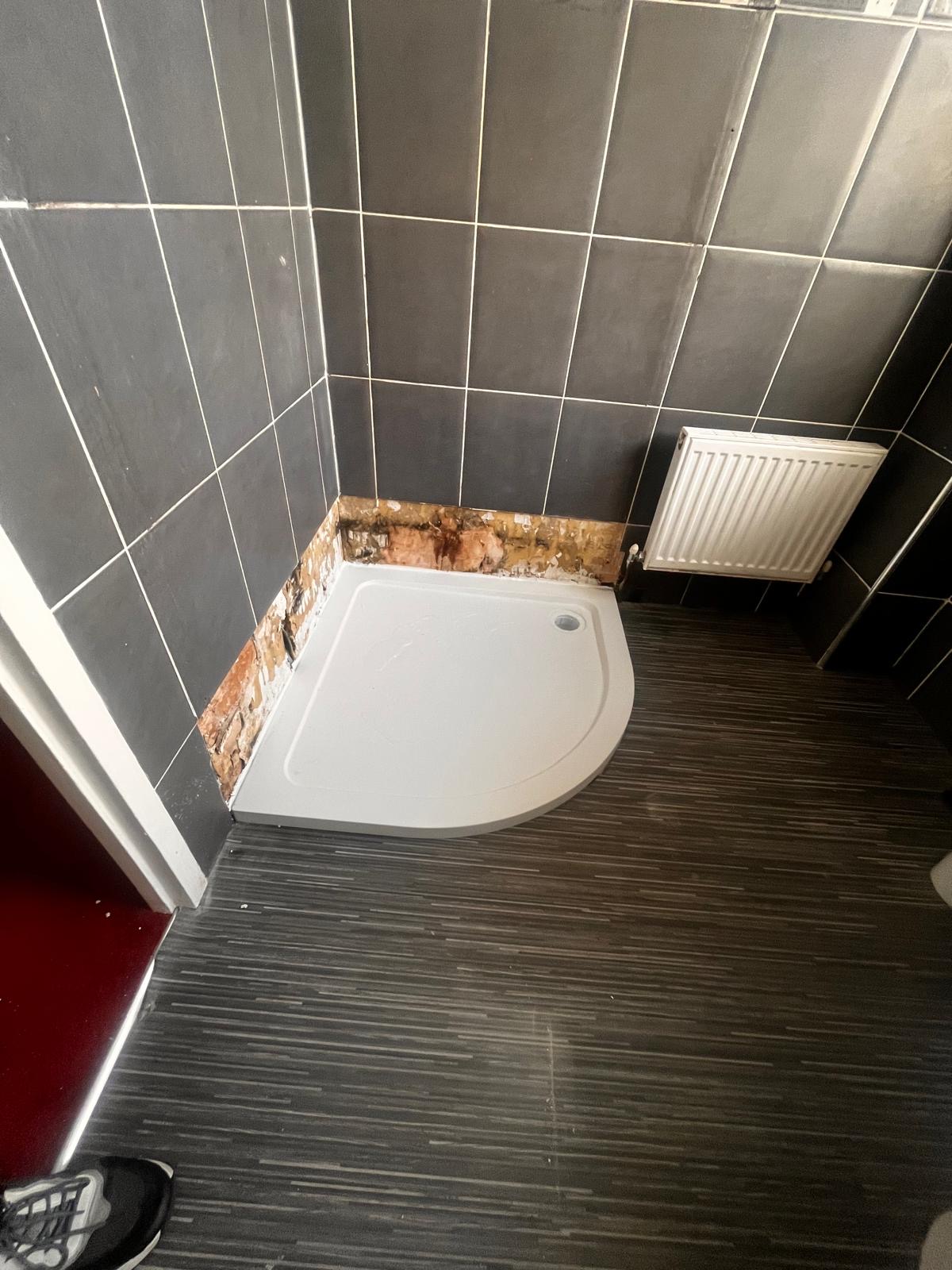 New quadrant shower tray fitted during renovation