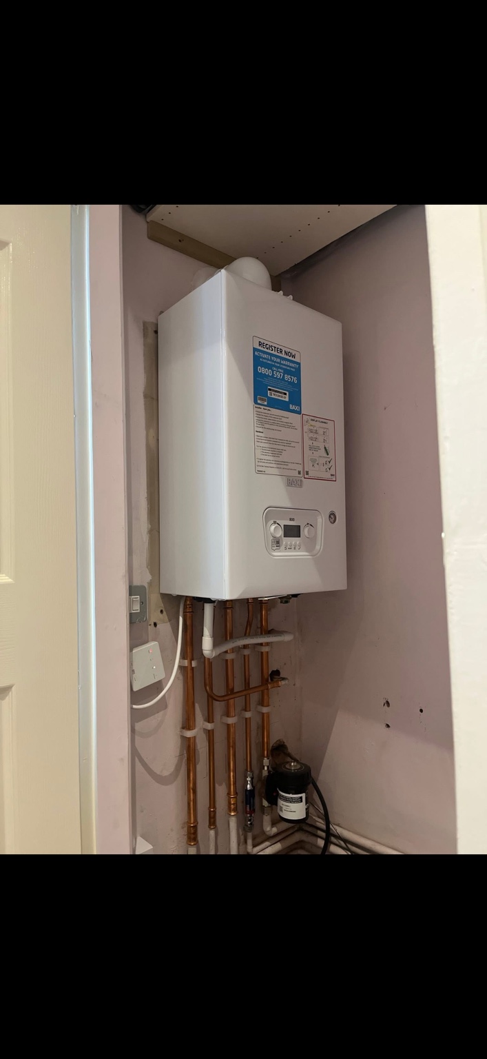 Baxi boiler neatly fitted inside a cupboard