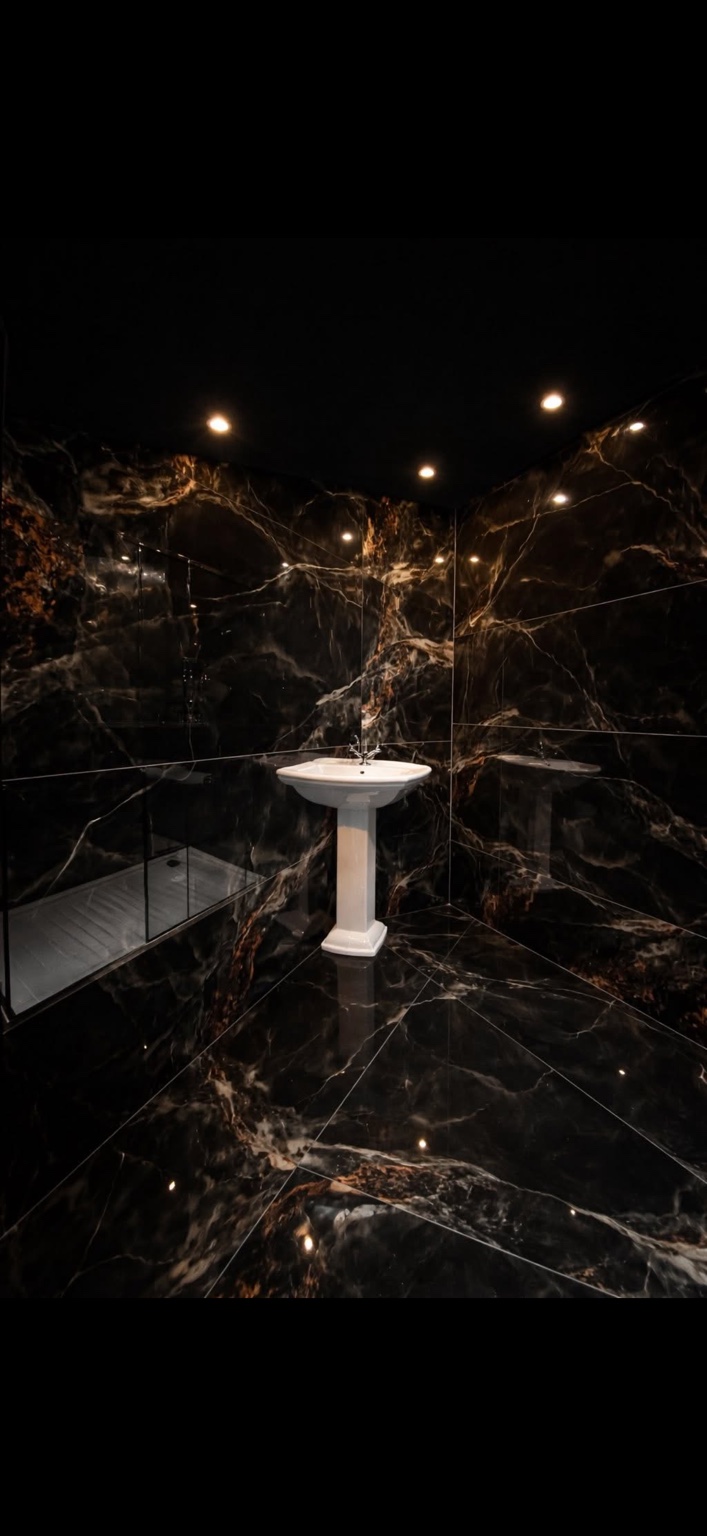 Completed luxury black tiled bathroom